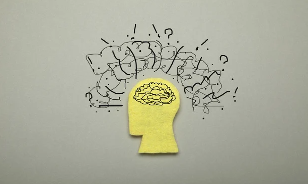 Graphic of a head with graphic swirls above the brain, representing turmoil and confusion