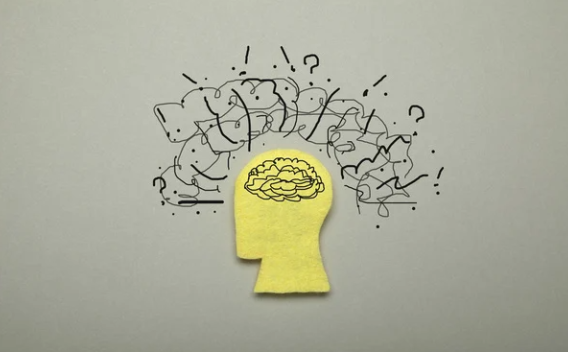 Graphic of a head with graphic swirls above the brain, representing turmoil and confusion